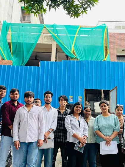 Our interior design students pose for a group photo outside the Shanti Vihar site after a productive session on practical Vastu applications.