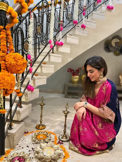 A moment of quiet reflection during Diwali celebrations, sitting by the rangoli in my festive kaftan.