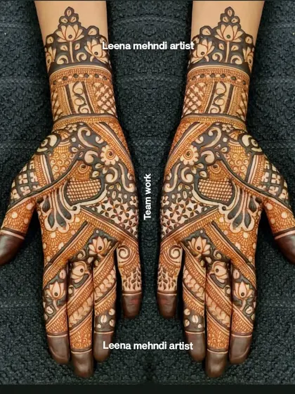 A collaborative piece of teamwork for a bridal party. This design features intricate peacock and floral motifs, with a mix of bold and fine lines creating a rich, textured look.