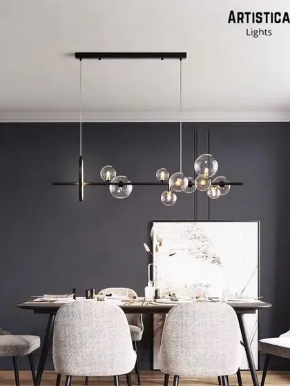 Perfect for a contemporary dining room, this linear chandelier features a series of bubble glass globes along a sleek black bar. It provides excellent task lighting over a long table while adding a touch of modern elegance and visual interest.