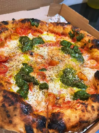 Another look at my Burrata Pesto Pizza, this time ready for delivery. The combination of the creamy burrata and savory pesto is a customer favorite.
