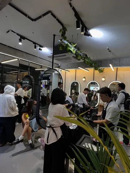 The salon buzzing with clients and stylists. This is the creative and social environment I've always wanted to build for my community.