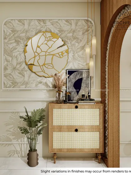 A close-up of the foyer, showcasing a blend of textures and materials. The cane-fronted console, decorative mirror, and traditional mouldings create a look that is both rustic and refined.