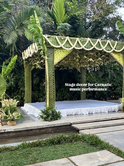 A unique stage made entirely of woven coconut and banana leaves, designed for a traditional Carnatic music performance at a wedding.