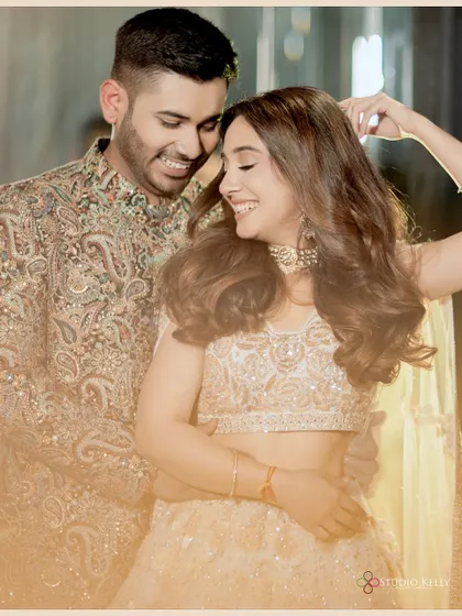 A happy and candid moment of the couple, capturing their genuine smiles and laughter.