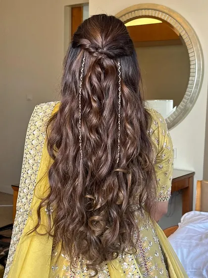 The full back view of the simple half-updo, showcasing the length and beautiful texture of the waves.