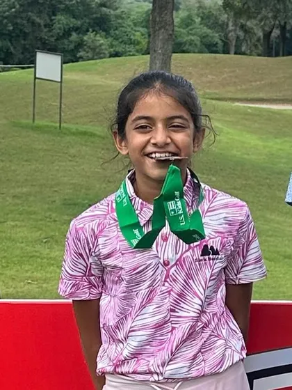 A joyful Suhani Chandra after her podium finish at the US Kids Golf Championship.
