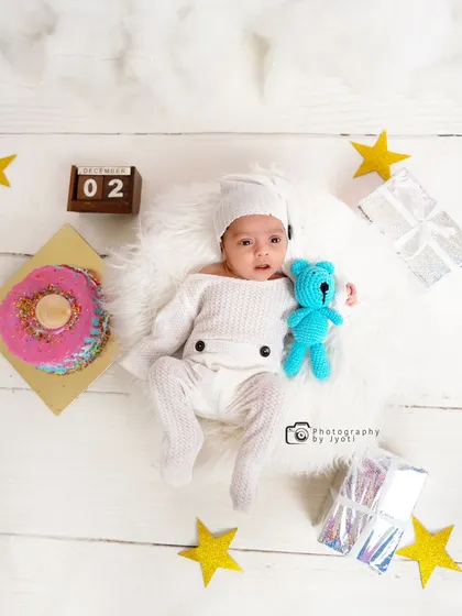 Another adorable top-down view from the milestone session, this time with a little blue teddy bear. I use a variety of props to add color and interest to the photos.