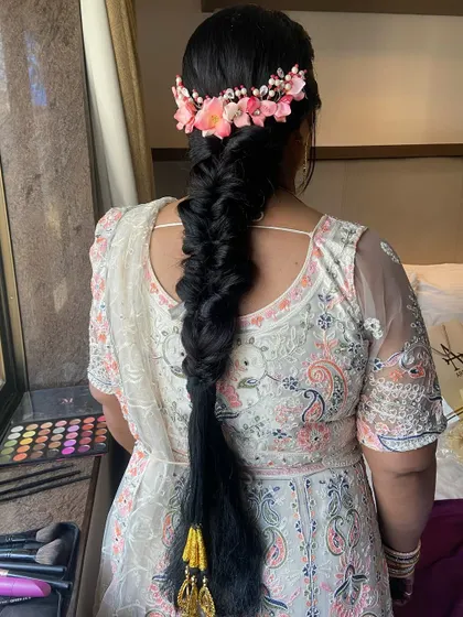 The length and thickness of this fishtail braid make it a true statement hairstyle for a pre-wedding event.