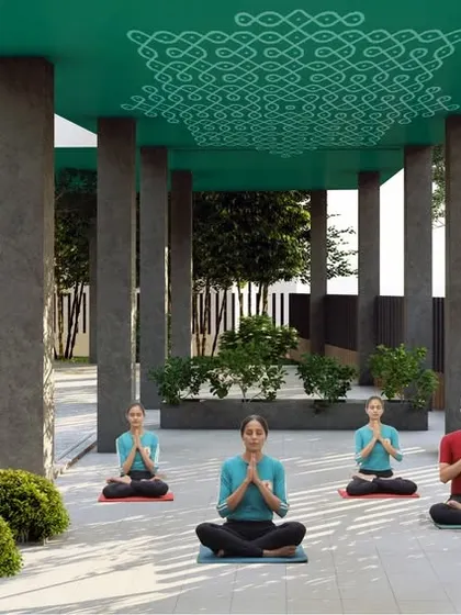 We designed a dedicated, semi-covered pavilion for wellness activities like yoga. The ceiling features a traditional 'kolam' pattern, infusing the modern structure with cultural resonance.