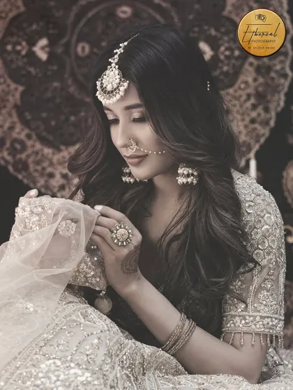 A soft, desaturated portrait that gives a vintage, timeless feel to this traditional look.