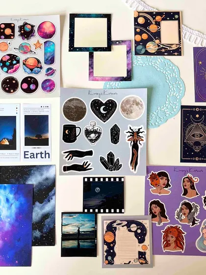 The Cosmic themed journaling kit, featuring planets, moons, and mystical illustrations for celestial-inspired pages.