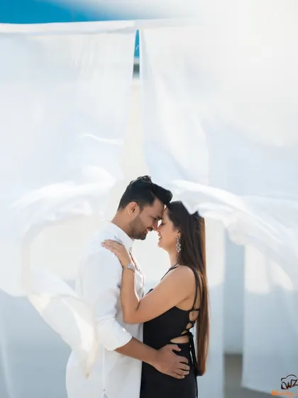 This pre-wedding shot for Jui and Vaikrant uses simple elements like flowing white fabric to create a dramatic and timeless portrait. It’s a great example of how we can achieve a high-fashion, cinematic look in a natural setting.