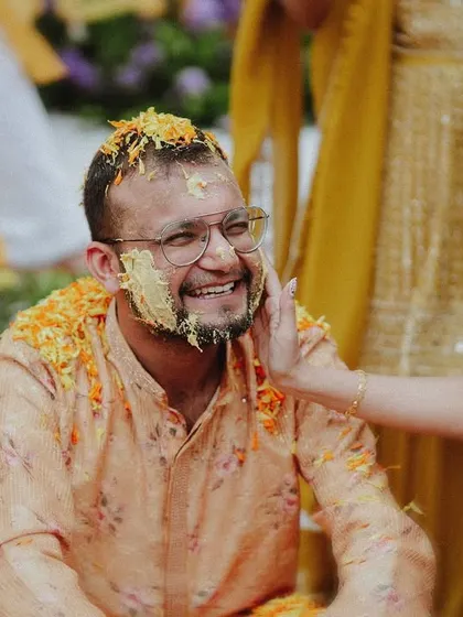 A duplicate of the tender moment of haldi application, a classic and heartwarming shot.