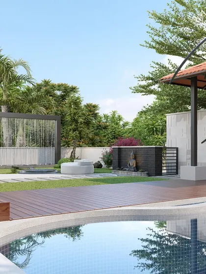 This view highlights the water elements in our garden design. A cascading water wall provides a soothing backdrop, while the main pool reflects the sky and surrounding trees. The layout ensures a tranquil atmosphere from every angle.