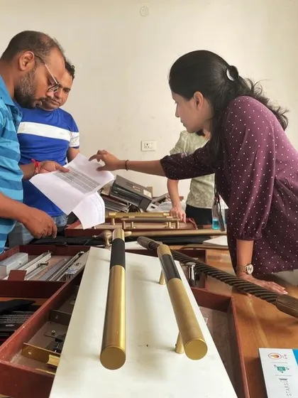 Our team carefully inspects hardware samples, such as door handles. This meticulous attention to detail ensures that every component of the building, no matter how small, aligns with the overall design vision.