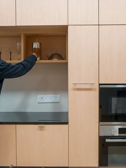 Even the smallest details, like the placement of shelving for everyday items, were considered in this kitchen remodel. Our process involves understanding the user's habits to create a design that is not just beautiful, but intuitively functional.
