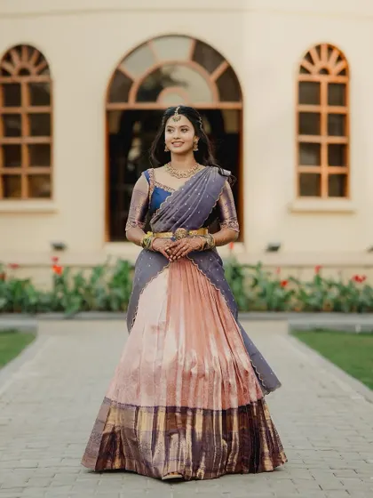 A full-length portrait of Brunda in her custom langa voni.