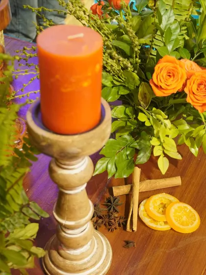 Let's look at some cute detailing. We used spices like star anise and cinnamon sticks alongside scented candles and dried oranges to create a multi-sensory experience.