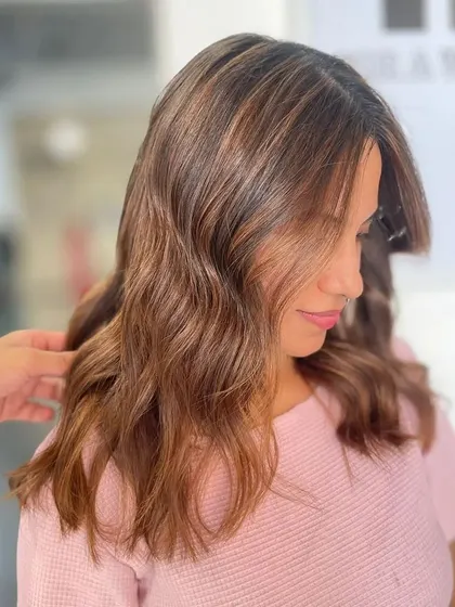 A side view of the attitude-changing hair, showing the soft waves and subtle highlights.