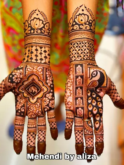 A design that combines peacock and elephant motifs with intricate geometric patterns. The solid fingertips complete the traditional look.