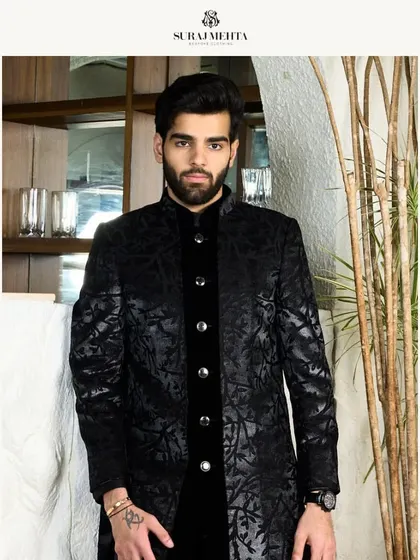 This black-on-black textured kurta is the epitome of understated luxury. It is designed for formal occasions where elegance is communicated through fine details.