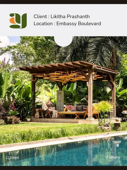 A poolside gazebo designed for a client at Embassy Boulevard. The structure is nestled among tropical foliage, creating a shaded, resort-like lounge area perfect for relaxation.