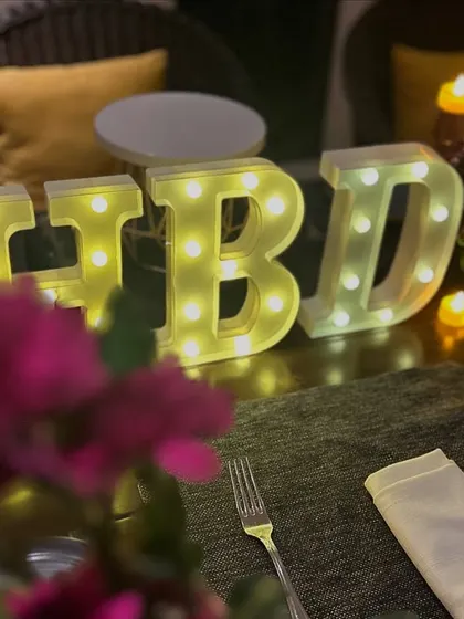 We can add small, personalized touches like these 'HBD' marquee letters to make your dinner celebration even more special.