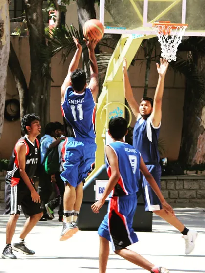 A throwback to my college basketball days in 2014, going up for a layup in a competitive game. These are the moments that fueled my passion for sports performance.