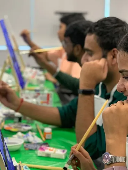 A smiling participant at the LinkedIn workshop. Our sessions are designed to be fun and relaxing, a perfect break from the usual corporate routine.