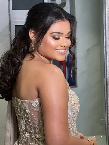This side view shows the volume at the crown and the beautifully curled ends of the ponytail.