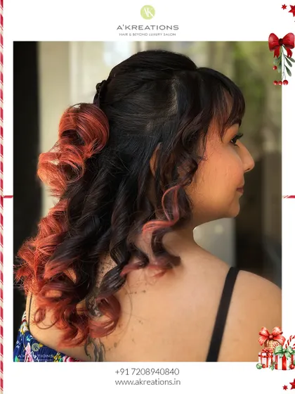 The back view of this unique party hairstyle, highlighting the contrast between the dark hair and the vibrant red curled ends.