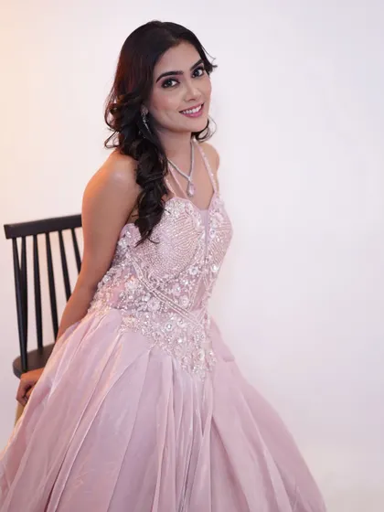 Pretty in pink and glowing with elegance. This is a perfect look for a reception or pre wedding event.