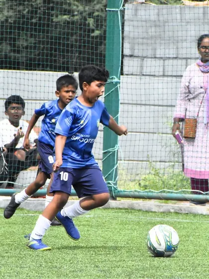 Celebrating our U-9 team's championship win at the Mega International Football Tournament. These moments of victory are what our young athletes train for.