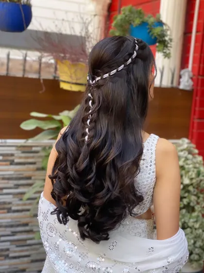 A soft, braided half-updo for a Roka ceremony. The extensions add just the right amount of volume and length for a look that is both traditional and modern.