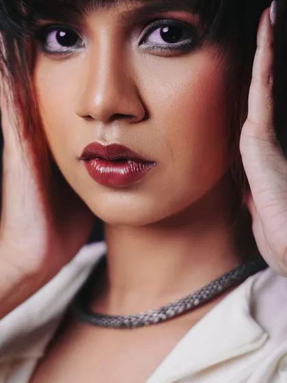 An intense, direct-gaze close-up. This kind of shot is incredibly powerful and perfect for a beauty or headshot portfolio.