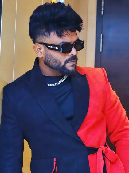 A close-up portrait showcasing the sharp cut of the blazer and my accessories.