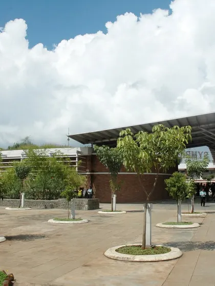 The open plaza at Symbiosis University, dotted with trees, serves as a central gathering point. This space exemplifies our principal architect's belief that engaging with people from diverse backgrounds outside the classroom is crucial for a student's overall development.