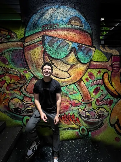 Posing against some cool graffiti art before a tour week that took me from Bangalore to Guwahati.