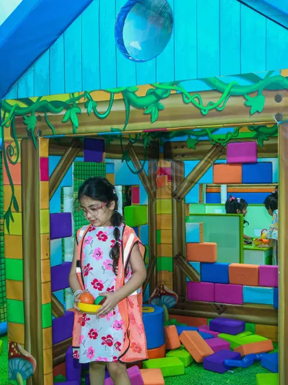 Building and creating with soft blocks. This activity helps toddlers develop their fine motor skills and creativity.