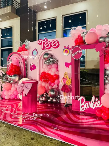 A side view of the elaborate Barbie-themed stage, showcasing the multiple layers and decorative elements.