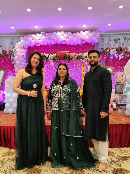 With the guests of honor. I always make sure to connect with the family and capture these happy memories together.