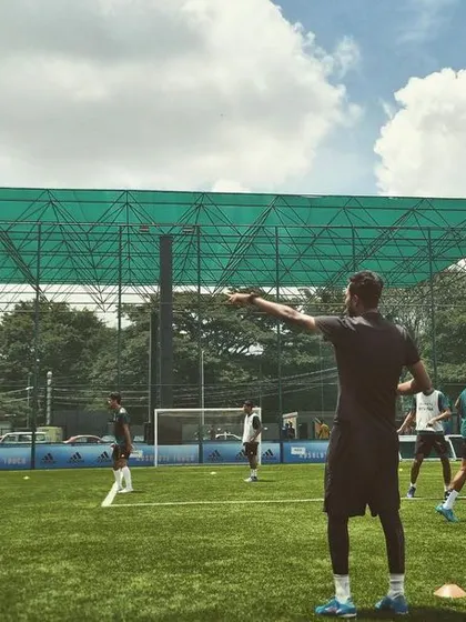 Another shot of our coach organizing the team's tactical shape during a training session. Understanding the system is as important as physical skill.