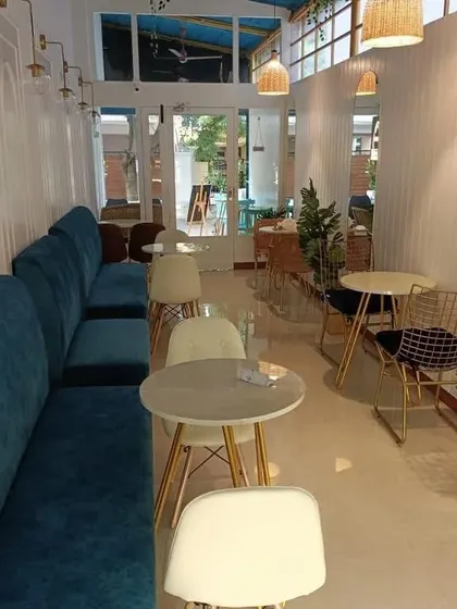 Seating is more than just functional; it's a core part of the customer experience. We selected plush, teal banquette seating to provide comfort and add a strong pop of color against the clean, white paneled walls.