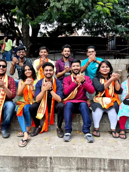 The group wearing traditional scarves during the Ganesh festival celebrations in Pune.