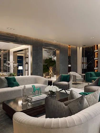 An expansive living area designed with multiple seating groups to accommodate large gatherings. We used a consistent palette of grey and emerald green to unify the different zones, creating a sophisticated and cohesive environment.