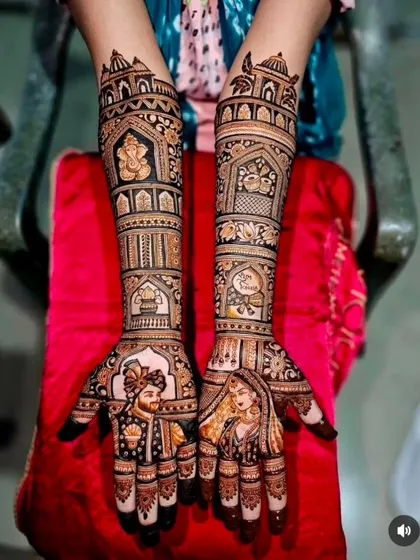 A classic and regal design with bride and groom portraits, Ganesha, and other auspicious symbols set within architectural frames.