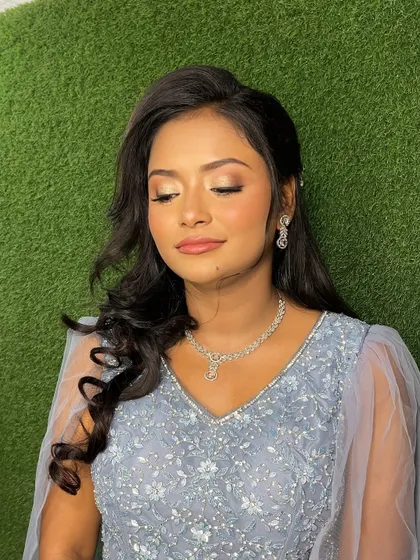 Makeup that feels and looks like skin. This close-up shows the soft, blended eyeshadow and the natural-looking base that enhances her features without being heavy.