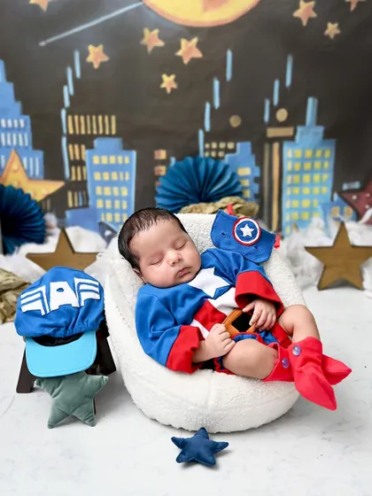 Our little Captain America is resting after a long day of saving the world. This fun superhero theme is always a hit with families.