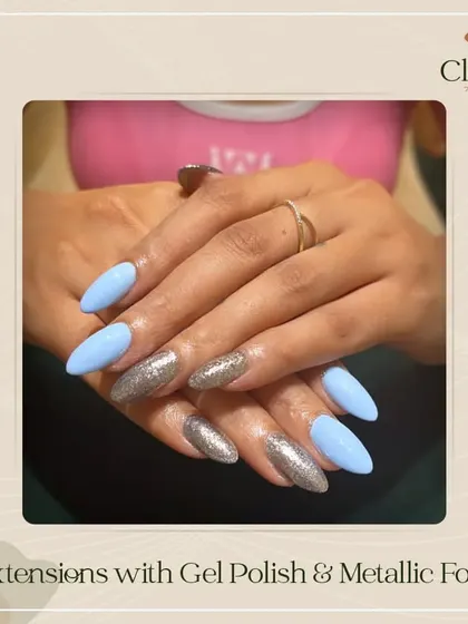 A pretty inspiration for your next nail appointment. This look features pastel blue extensions paired with accent nails covered in metallic silver foils for a cool-toned, edgy vibe.